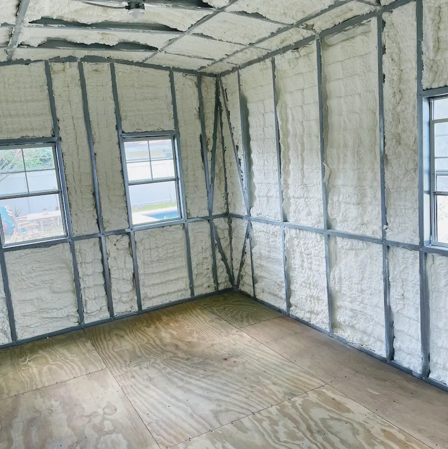 Closed-cell spray foam insulation applied to wall cavities in a residential project in Dalton